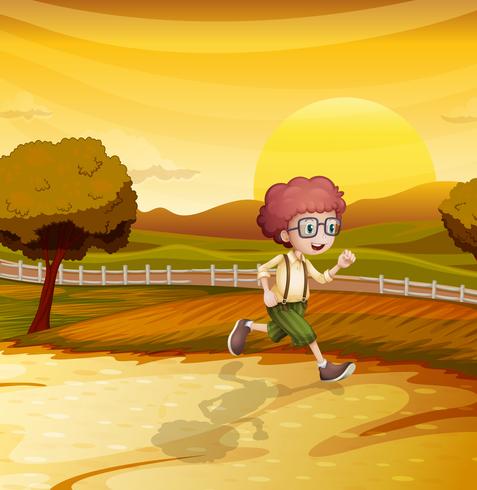 Una vista de la puesta de sol con un niño corriendo vector