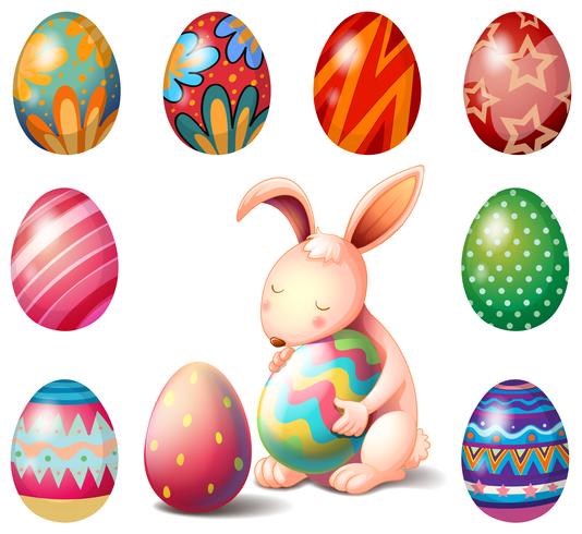 A bunny surrounded with Easter eggs vector