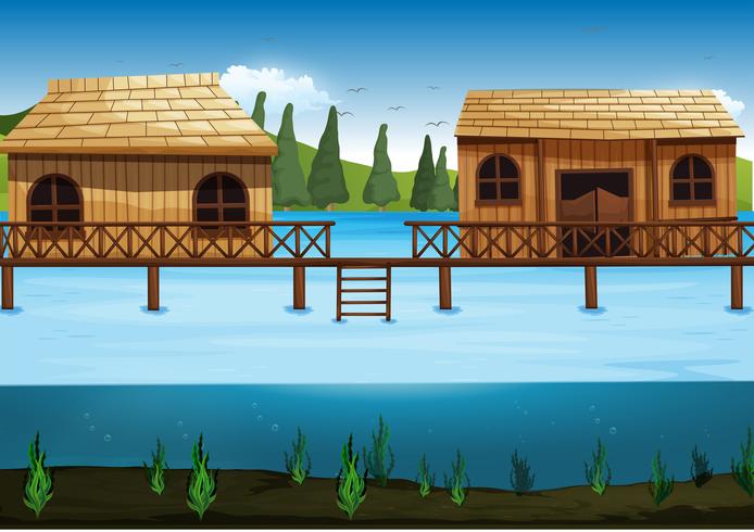 Escena con dos casas en el río. vector