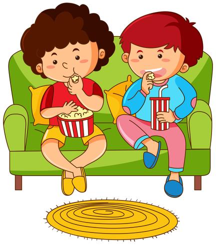 Dos niños comiendo palomitas en el sofá vector