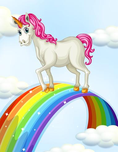 Un unicornio en el arcoiris vector