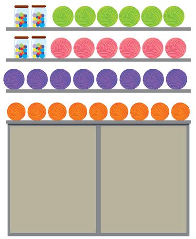 Diferentes hilos de colores en el estante. vector