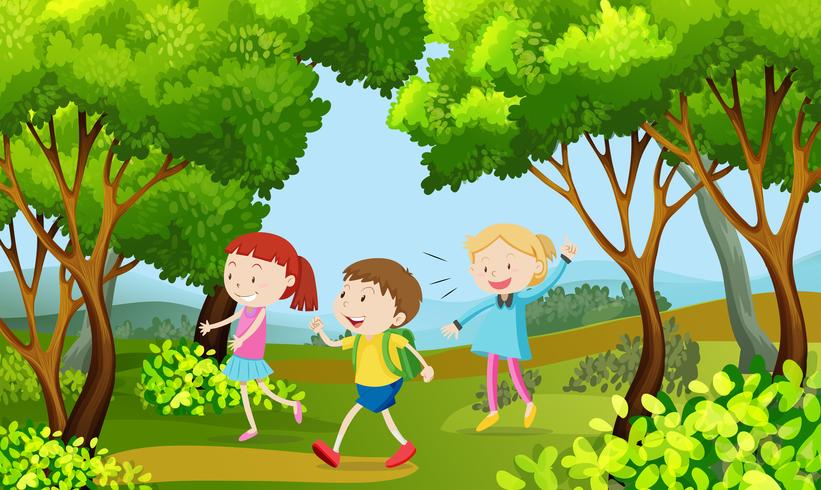 Tres niños caminando en el bosque vector