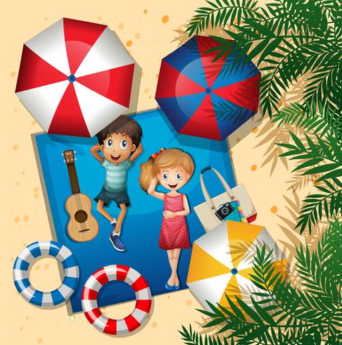 Boy and girl relaxing at the beach aerial view vector