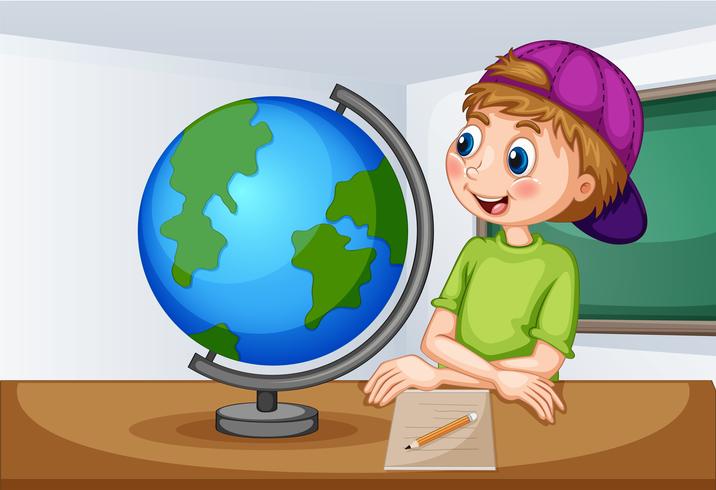 Boy looking at globe in classroom vector