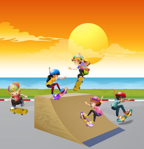 Children playing skateboard on the ramp vector