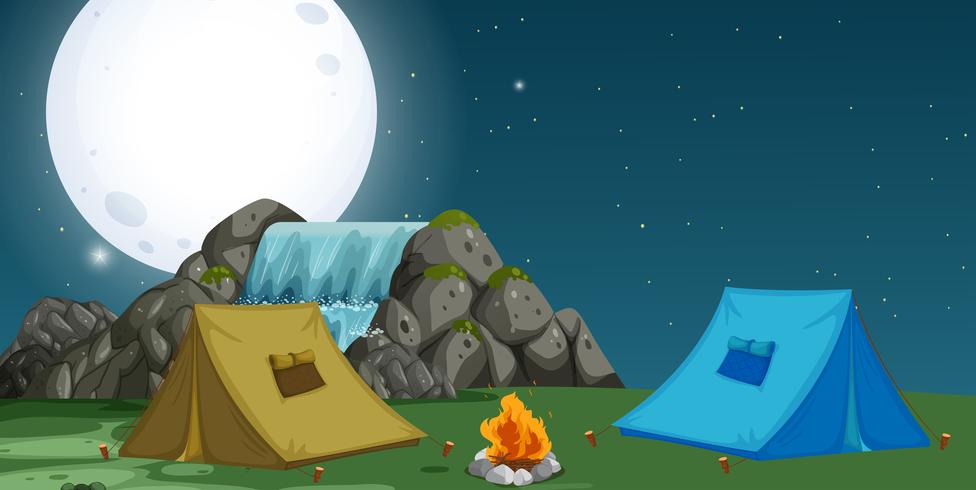 Una vista del camping por la noche. vector