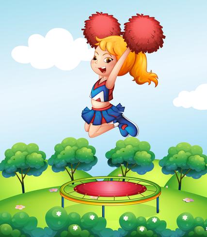 A cheerdancer holding her red pompoms above the trampoline vector