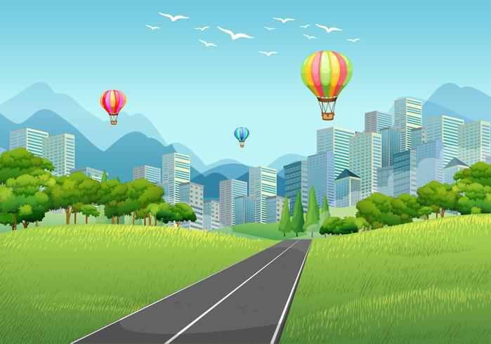 City scene with balloons and tall buildings vector