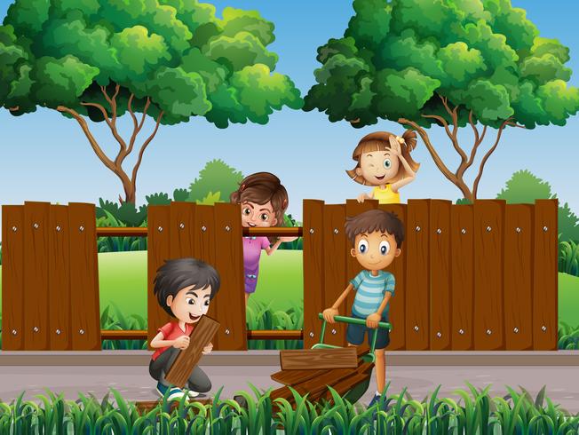 Children fixing fence in the park