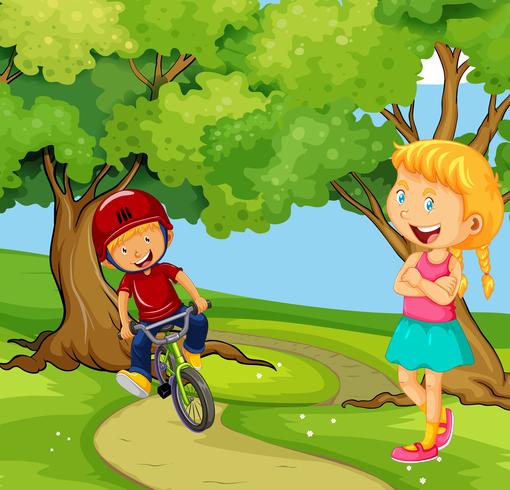 Boy riding bike in the park vector