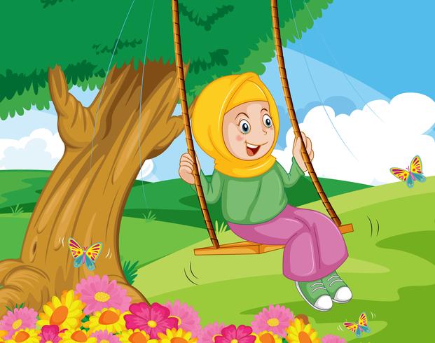 Una niña musulmana se sienta en el columpio en el jardín vector