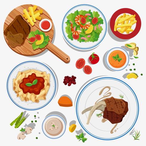 Different types of food on plates vector