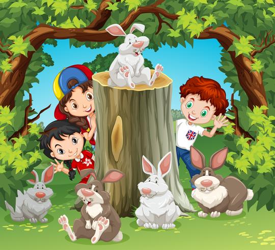 Children in the jungle with rabbits vector
