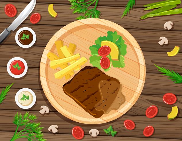 Steak and fries on round board vector