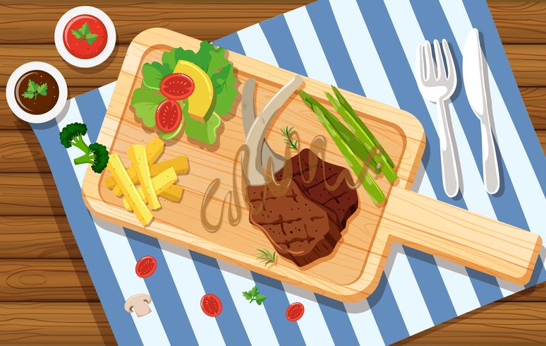 Lambchop and salad on wooden board vector