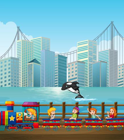 Children riding on train in the city vector