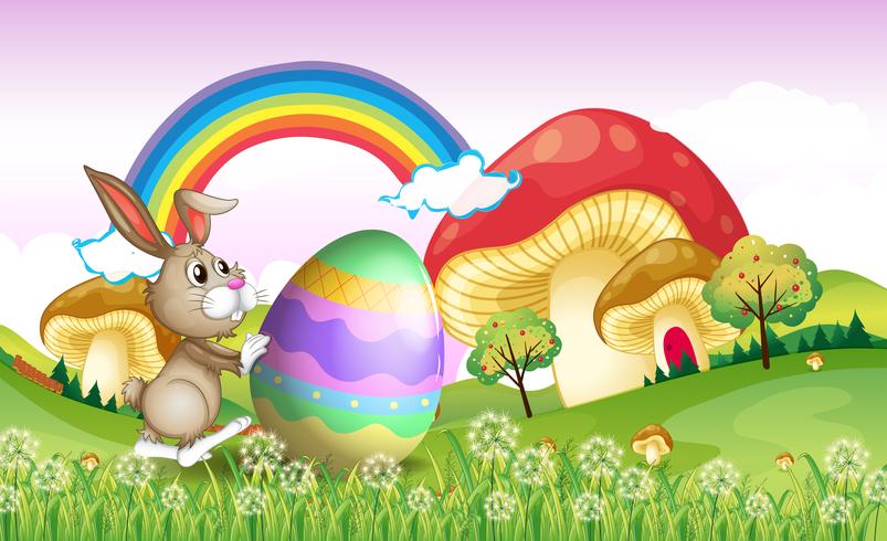 A bunny pushing an easter egg vector