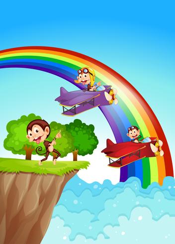 Playful monkeys at the cliff with a rainbow vector