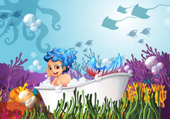 A bathtub under the sea with a mermaid vector