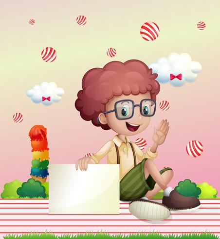 A boy holding an empty signage with flying candy balls at the back vector