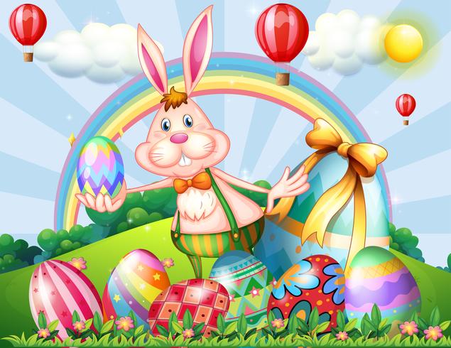 A bunny at the hilltop with Easter eggs vector