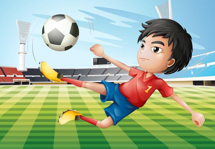 A boy playing soccer at the soccer field vector