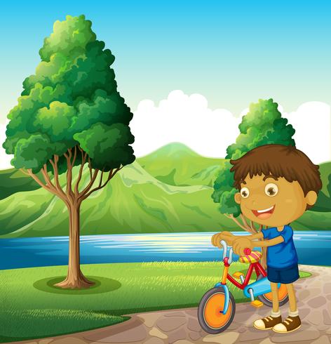 Un niño en la orilla del río jugando con su bicicleta. vector