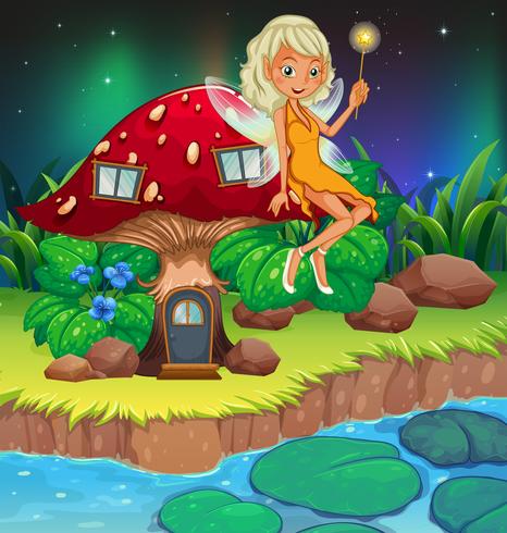 A fairy above the red mushroom house vector