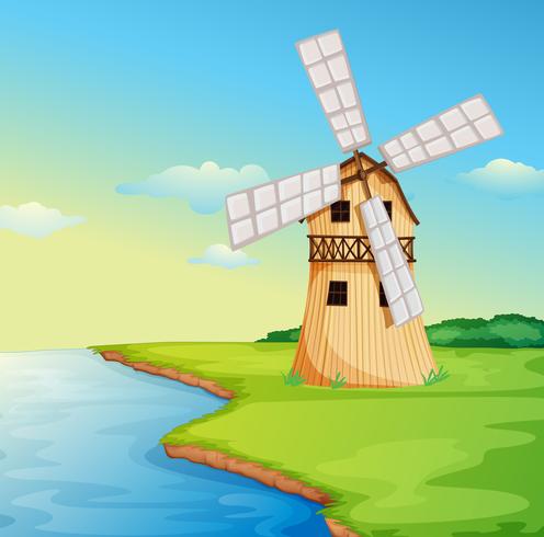 A windmill along the river vector