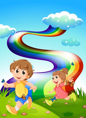 Niños caminando en la colina con un arco iris en el cielo vector