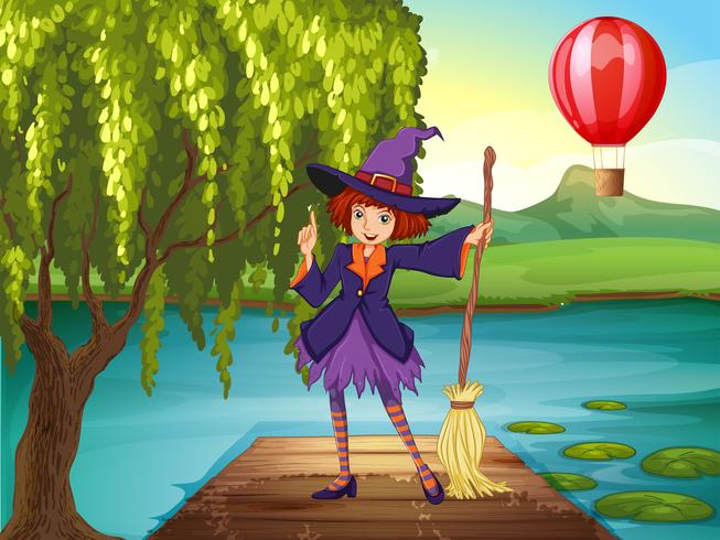 A witch holding a broom standing at the port vector