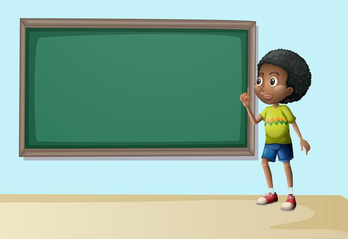 A boy near the empty blackboard vector