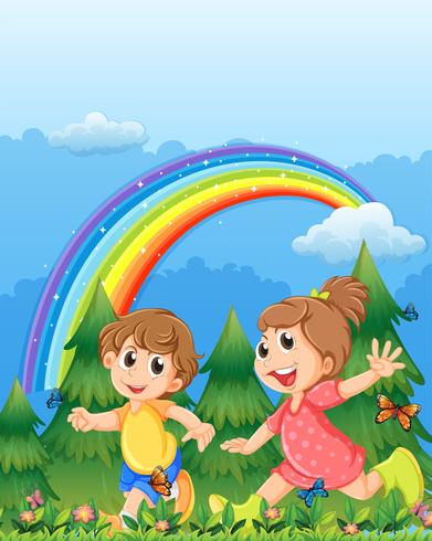 Niños jugando cerca del jardín con un arco iris en el cielo. vector