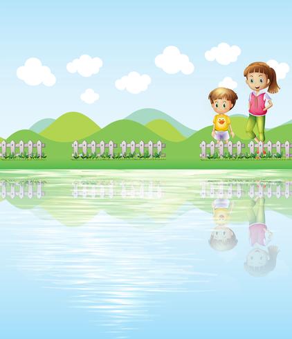 Un niño y una niña mirando el lago. vector