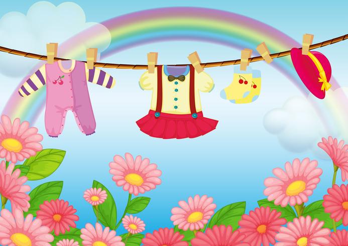 Baby clothes hanging in the garden vector