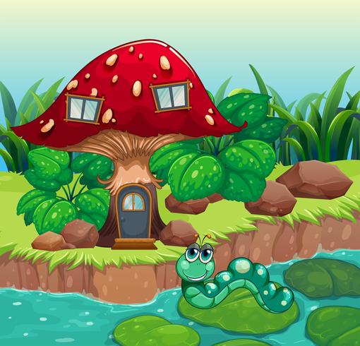 A worm near the red mushroom house vector