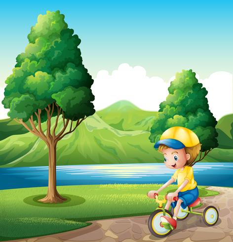 Un niño jugando con su pequeña bicicleta. vector