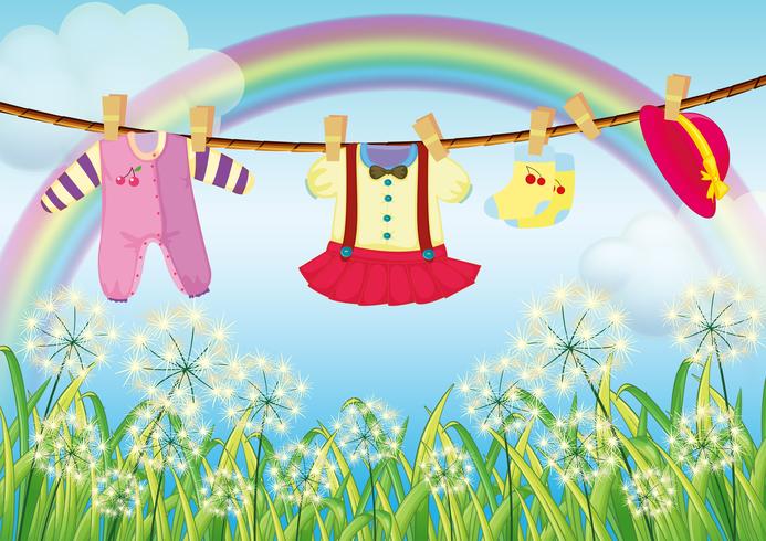 Kids clothes hanging near the grass vector