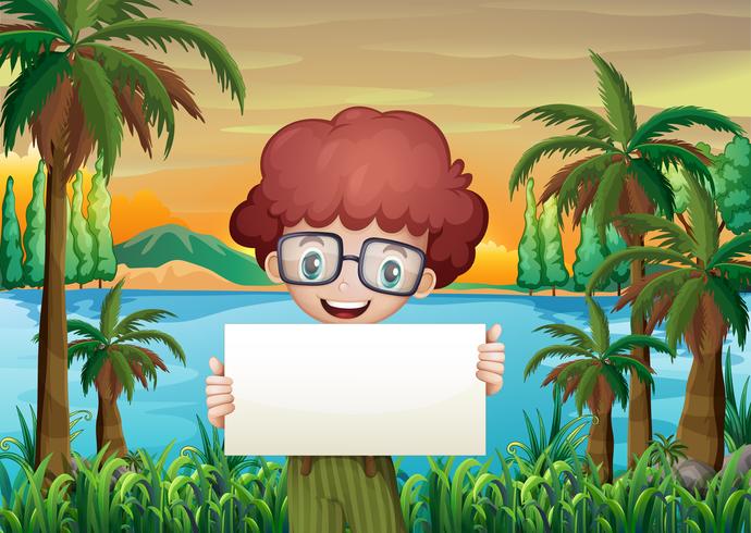 A smiling boy holding an empty signboard vector