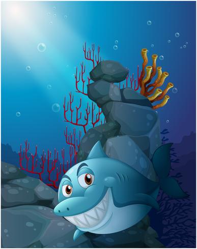 A smiling shark under the sea near the rocks vector