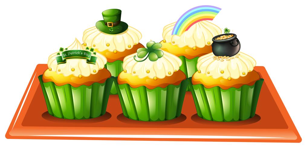 Una bandeja con cinco cupcakes. vector