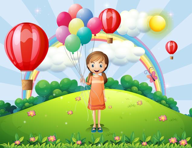 Una niña sosteniendo globos vector