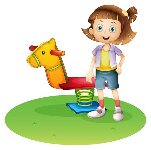 A girl standing beside a horse spring toy