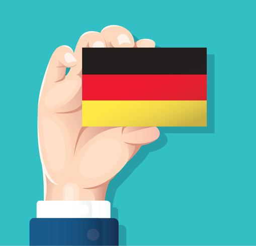 mano que sostiene la tarjeta de la bandera de Alemania con fondo azul vector