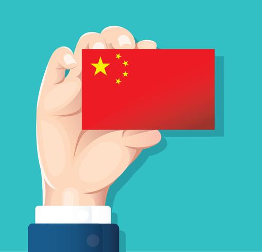 mano que sostiene la tarjeta de la bandera de china con fondo azul vector