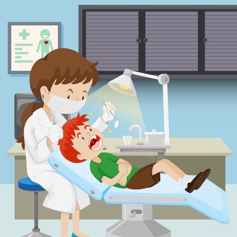 Un niño en la clinica dental vector