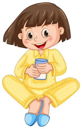 Niña en pijama amarillo bebiendo leche vector