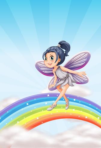 Fairy on a rainbow vector