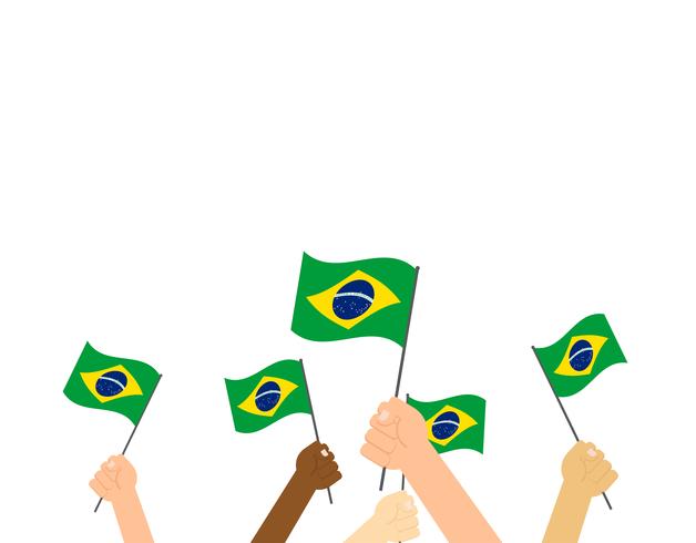 Manos de ilustración vectorial sosteniendo banderas de Brasil sobre fondo blanco vector